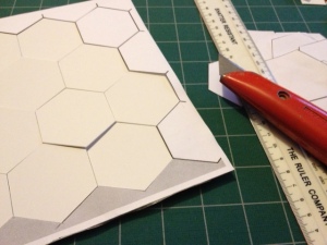 Cutting out hexagonal tiles